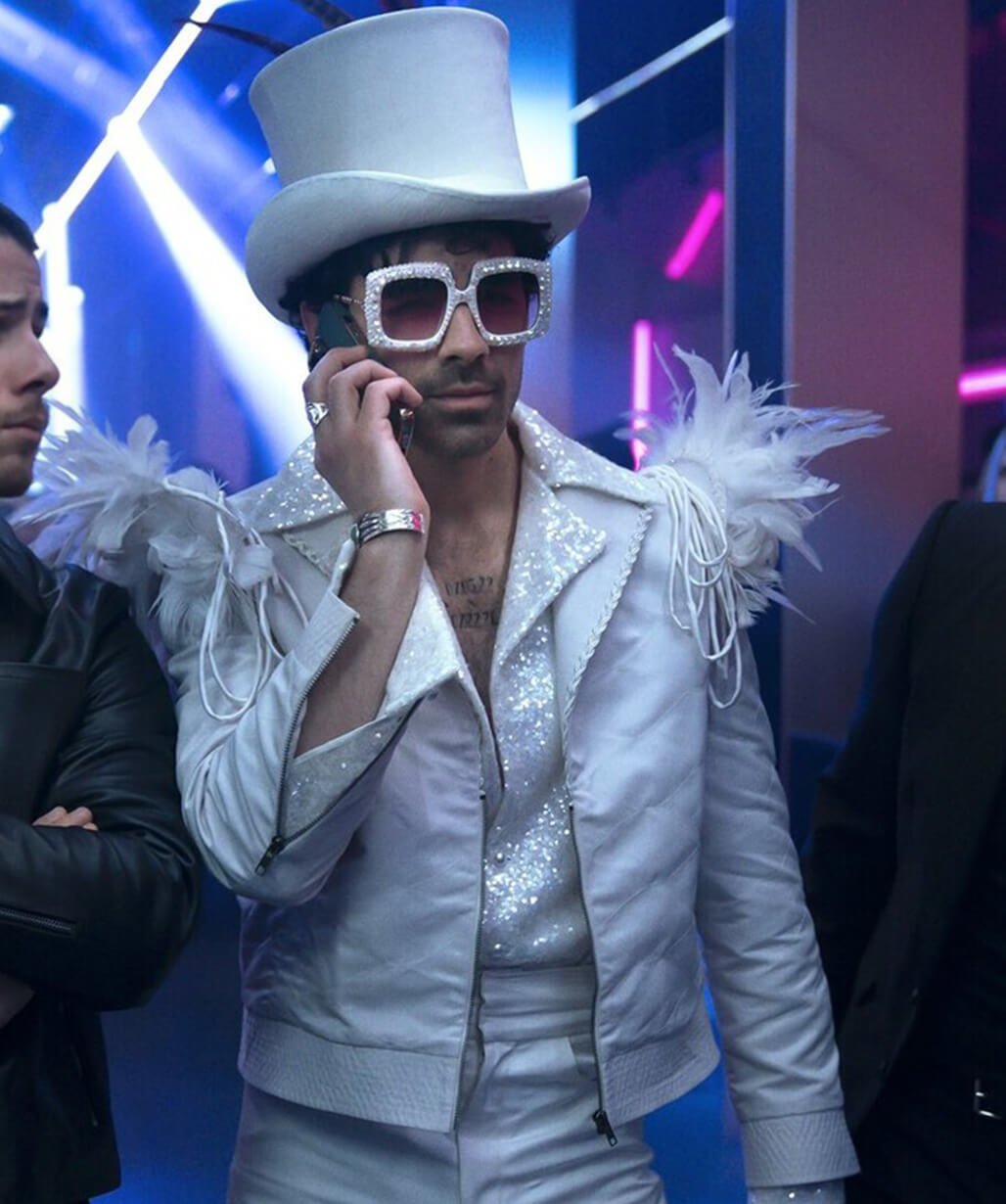 a-very-jonas-christmas-joe-jonas-white-jacket-outfit.jpg A Very Jonas Christmas Movie 2025 Joe Jonas White Coat - Image 1